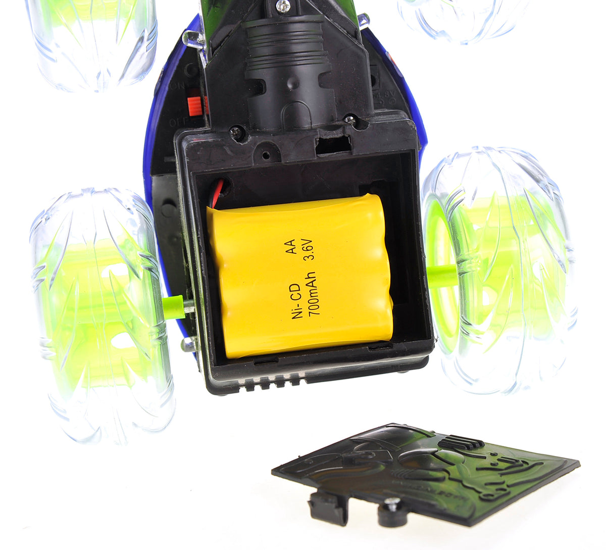 Close-up of a toy vehicle's battery compartment with a yellow battery labeled 'AA Ni-CD 3.6V 700mAh'.