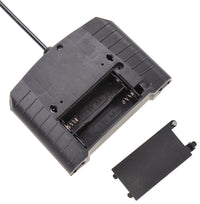 Black electronic component with a small black plate on a white background