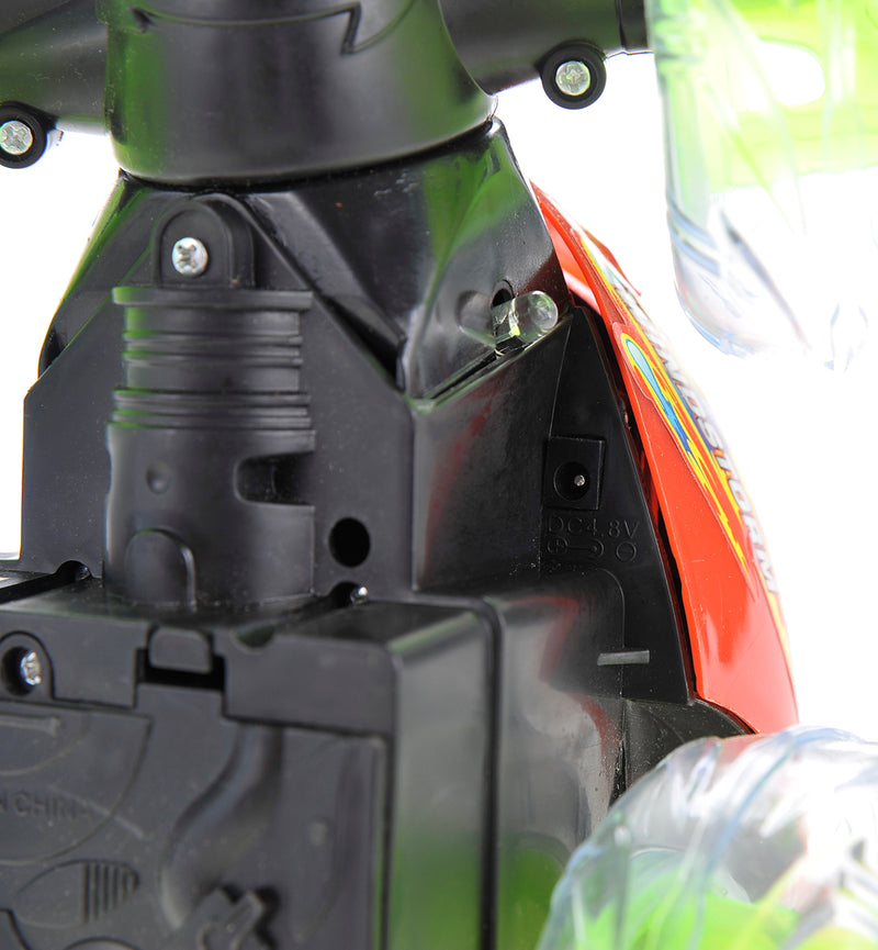 Close-up of a black mechanical component on a vehicle, with a blurred background.