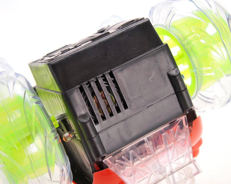 Close-up of a black electronic device with green and red components on a white background