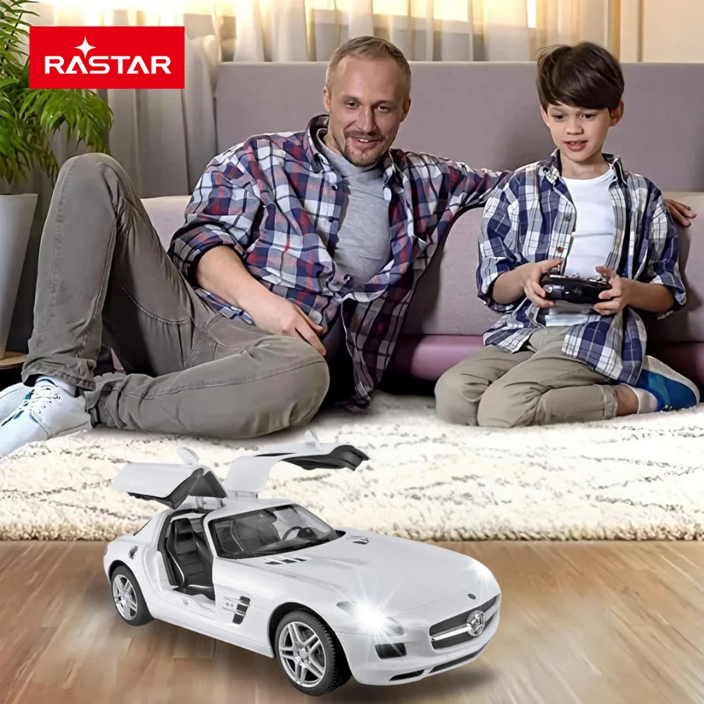 Father and son playing with Mercedes-Benz SLS AMG RC car with remote control indoors