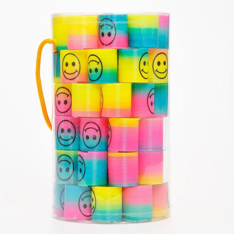 Container of Mini Rainbow Emoticon Springs - colorful coil spring toy collection in a clear container with smiley faces.