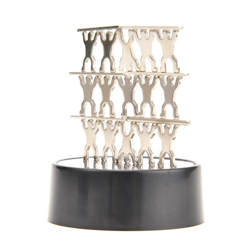 Multi-level magnetic sculpture created with metallic figures on a black base.