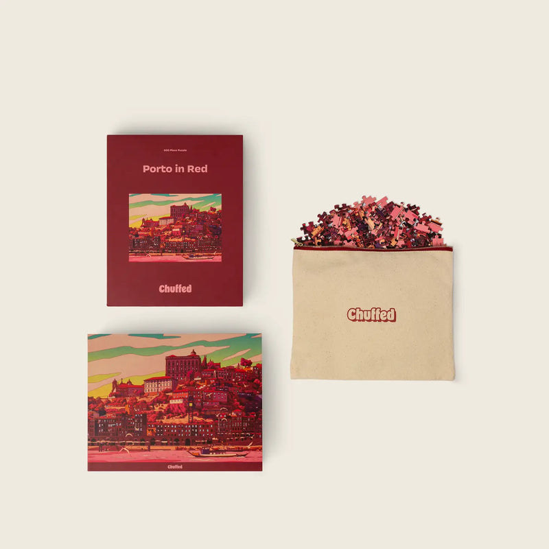 Two books with 'Porto in Red' cover design and a beige envelope on a light beige background.