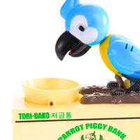 Close-up of blue parrot bird piggy bank, showing detail of coin slot and bowl.