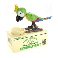 Green parrot coin-eating piggy bank with vibrant colors and coin bowl on a beige base.