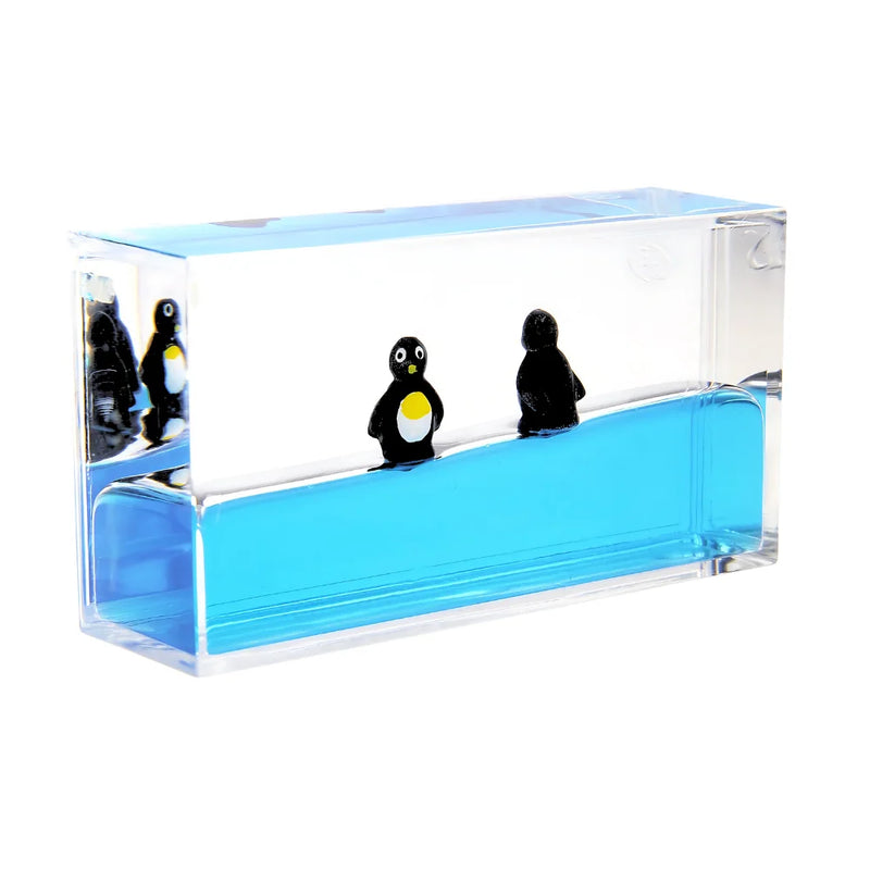 Penguin liquid motion sensory toy with calming blue water and floating penguins, perfect for stress relief and home decor