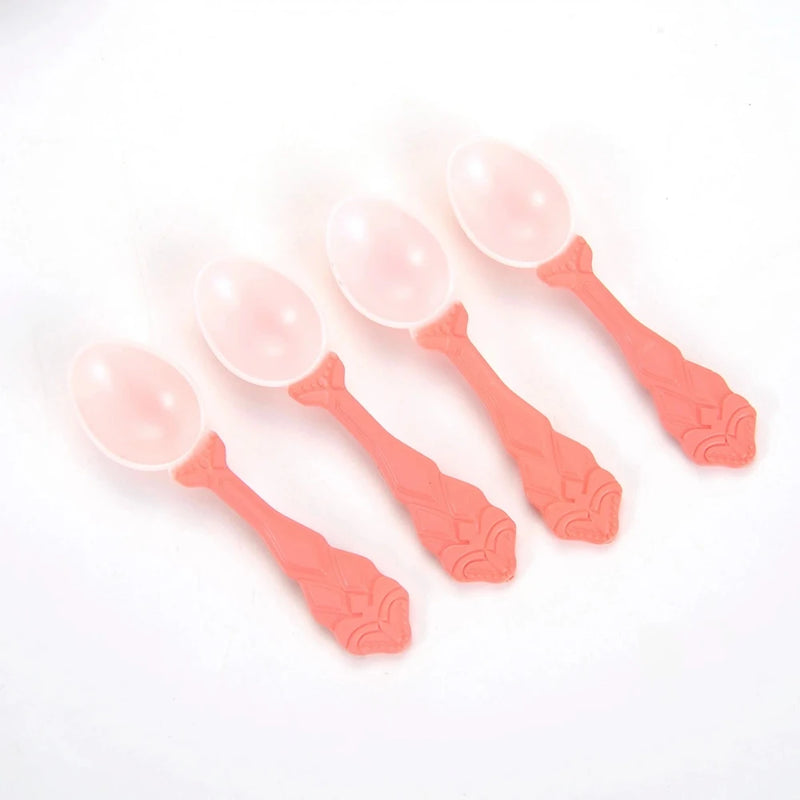 Set of pink spoons from a tea set for girls, great for kids' tea parties and pretend play