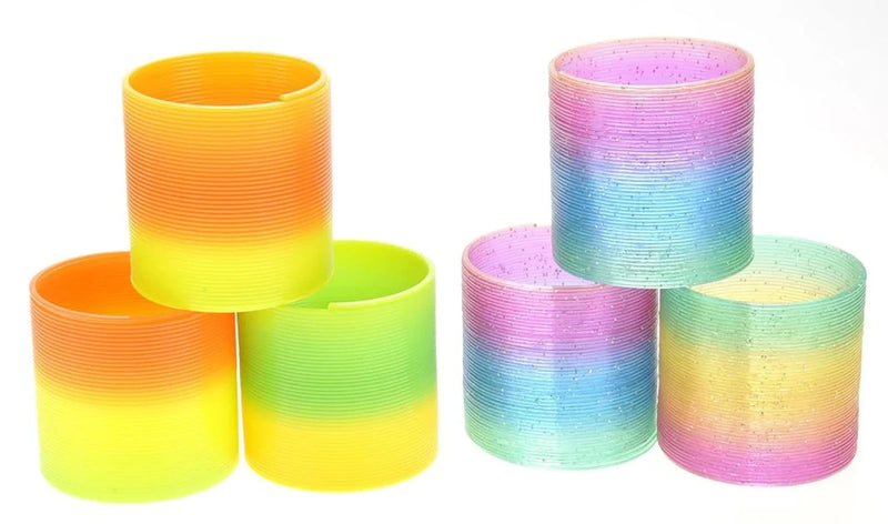 Variety of plastic rainbow magic springs in vibrant colors, perfect for playful stacking and stretching activities