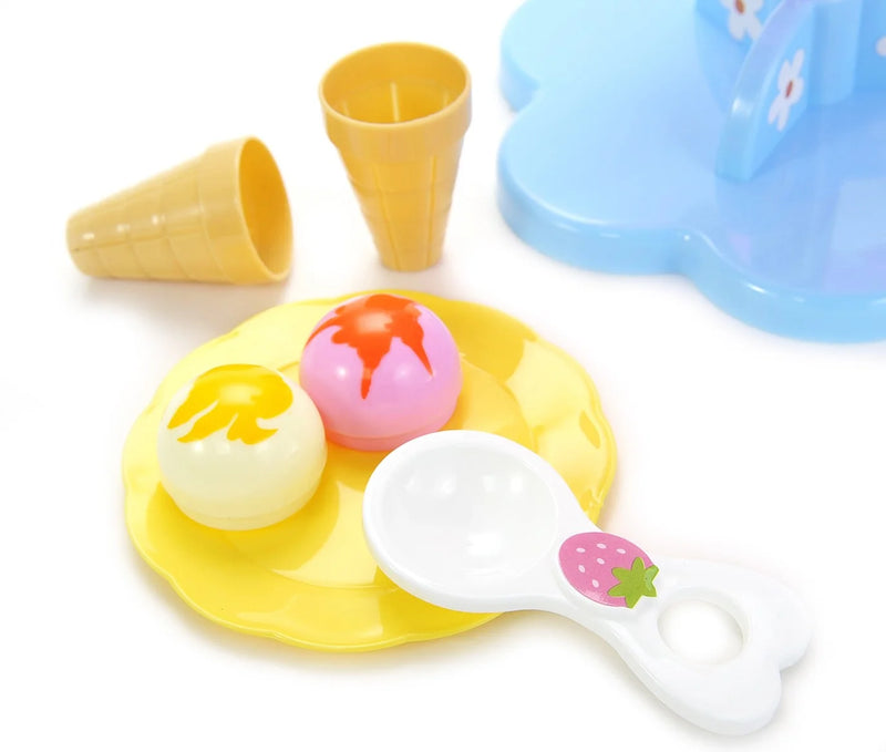 Yellow plate with dessert toppings, ice cream cones, and strawberry-themed scoop from the Play Desserts Ice Cream Set