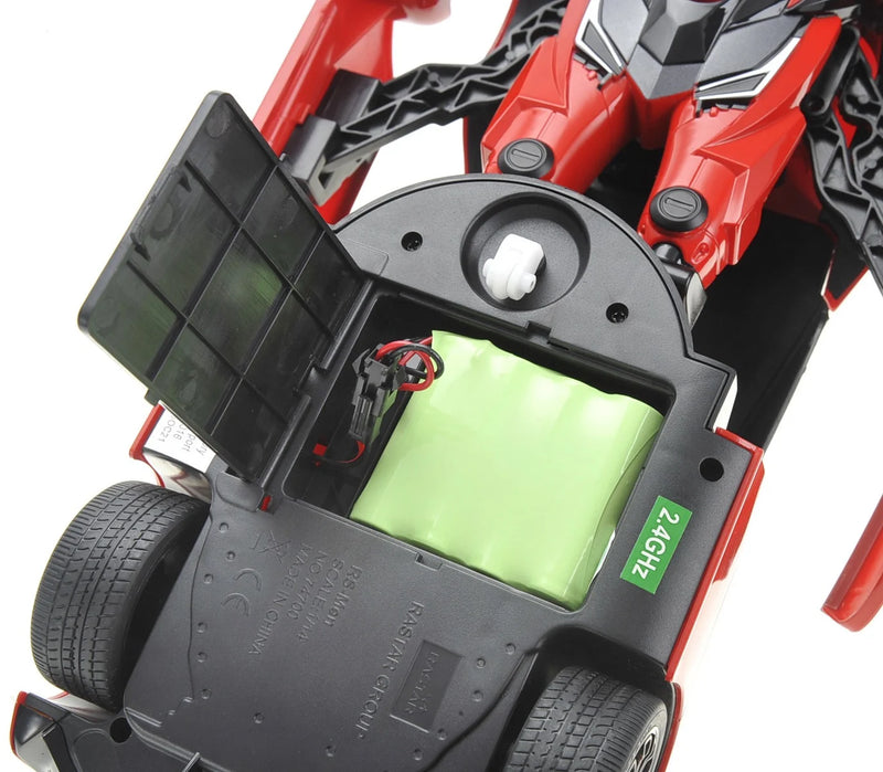 Close-up of a red and black robot toy with open body showing internal components.