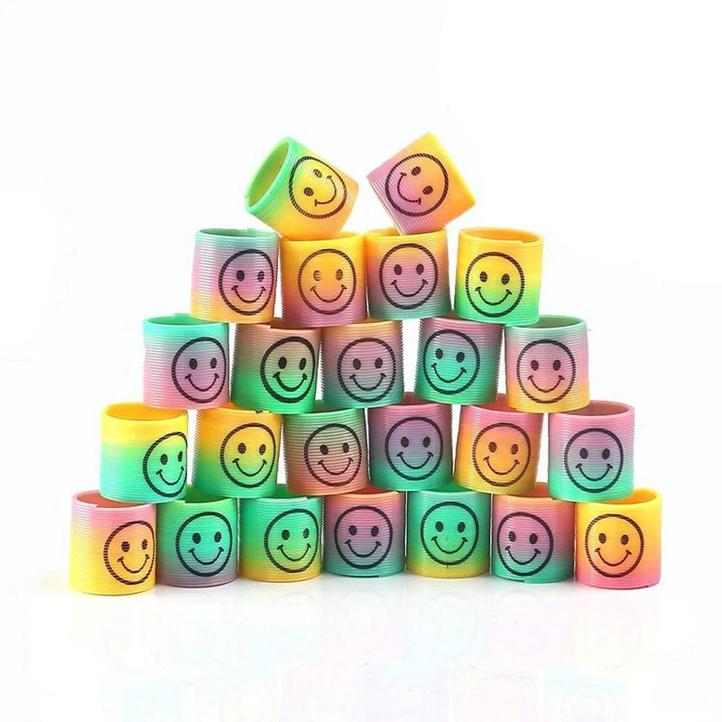 Pyramid Stack of Mini Rainbow Coil Spring Toys - playful arrangement of colorful toy springs with smiley faces