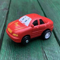 Close-up of red kids toy car from road map puzzle set, perfect for imaginative pla