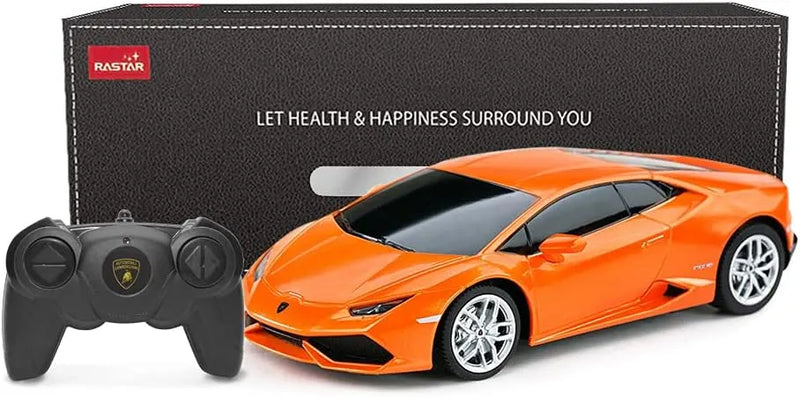 Orange toy car with remote control in front of a black box labeled 'Rastar'.