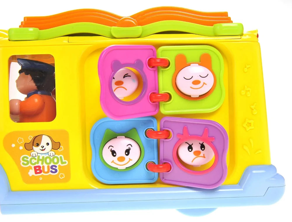  Side panel of school bus toy showing different expressions on colorful dials, enhancing kids' emotional learning.