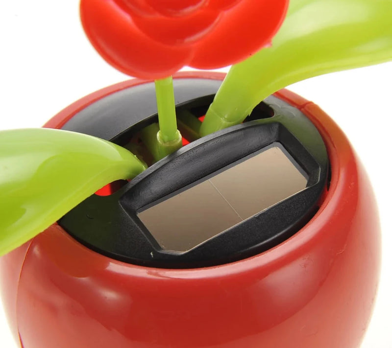 Solar flower pot toy showing the solar panel, powers the dancing flower using sunlight.