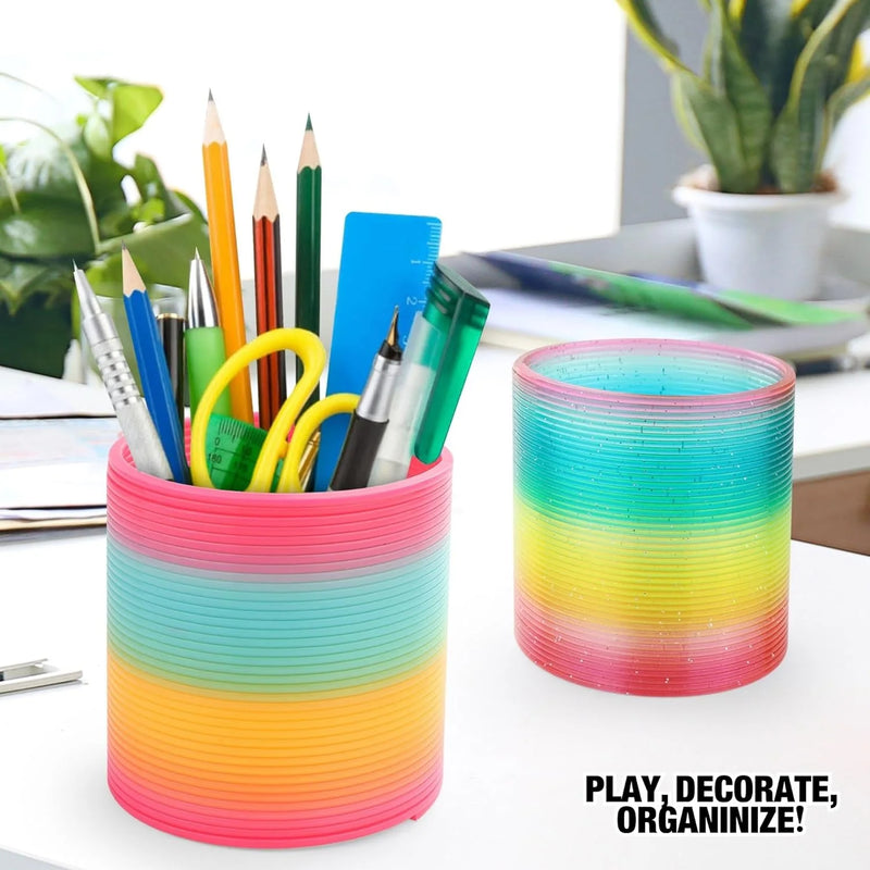 Colorful rainbow spring toy used as a pencil holder for play and organization.