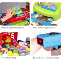 Close-up of kids supermarket playset with interactive cash register and food items.

