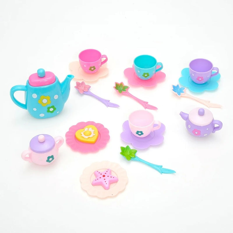 Colorful toy tea party set for kids with teapot, cups, saucers, and play utensils arranged for pretend play