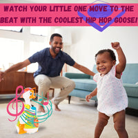 Toddler dancing with the coolest musical hip hop goose toy, enjoying the interactive play.