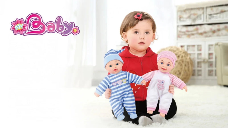 Toddler holding twin baby dolls dressed in blue and pink outfits - realistic cuddle baby dolls for kids