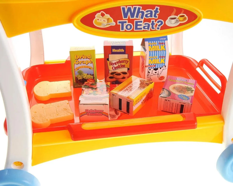 Children's toy food cart with pretend boxed food items including cookies, milk, and spaghetti.