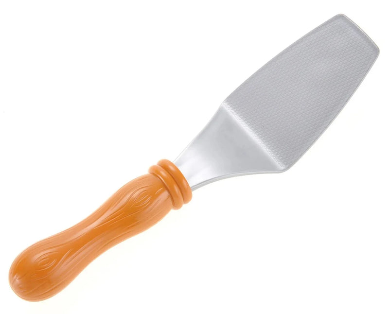 Close-up of toy spatula with textured handle, part of kids' pretend pizza playset