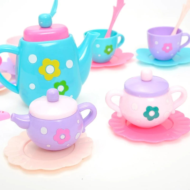 Toy tea party set featuring colorful teapot, sugar pots, and cups, perfect for toddler pretend play