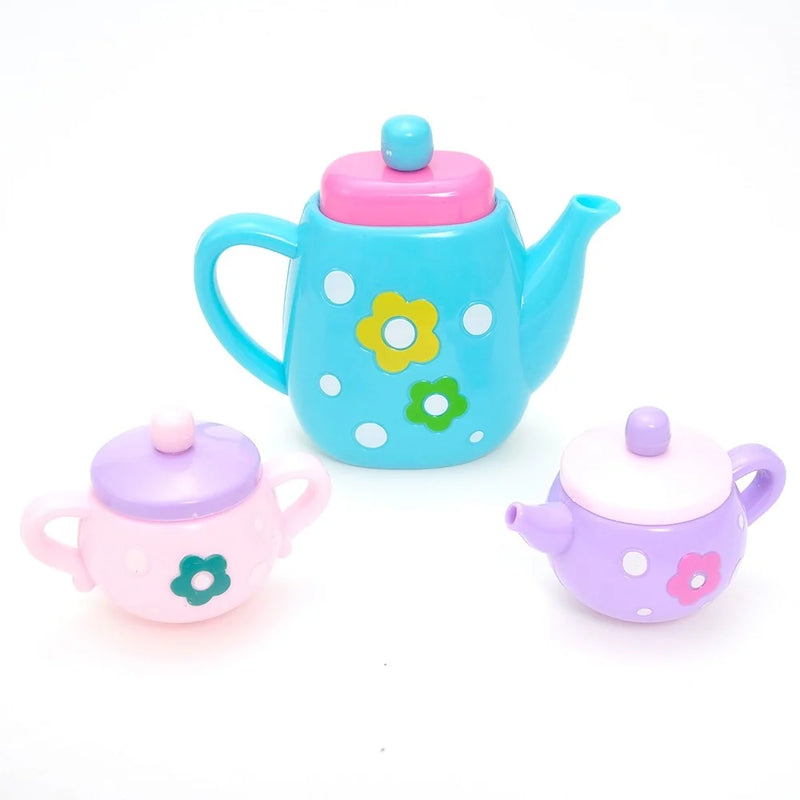 Teapot and sugar pots in a toy tea set with floral designs, ideal for toddler tea parties.