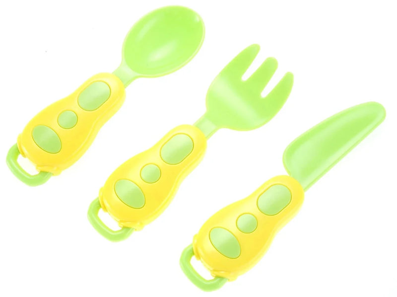 Toy utensils including spoon, fork, and knife with easy-grip handles for kids' kitchen play.