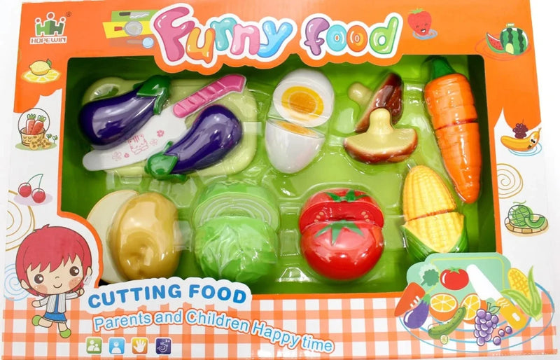 Packaging of toy vegetable cutting set for kids – colorful plastic vegetable and fruit pieces with a toy knife and cutting board