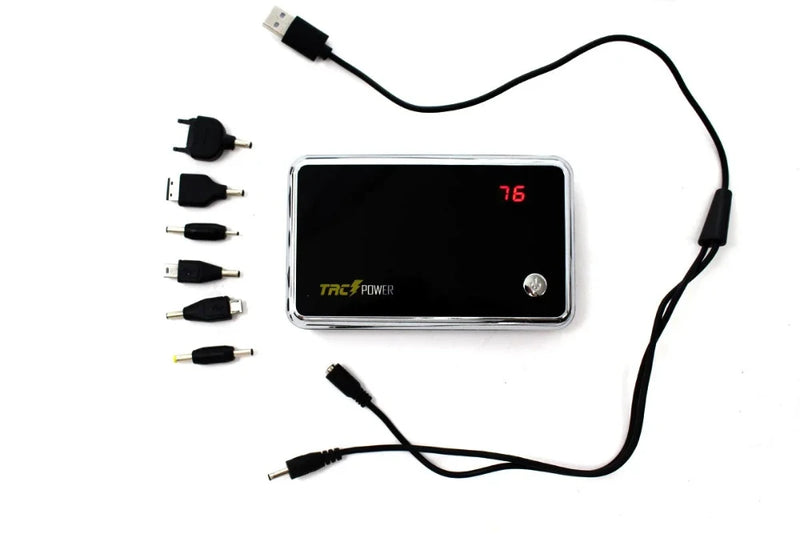TRC Power Bank with accessory set including multiple connectors, USB charging cable, and adapter heads for universal compatibility.