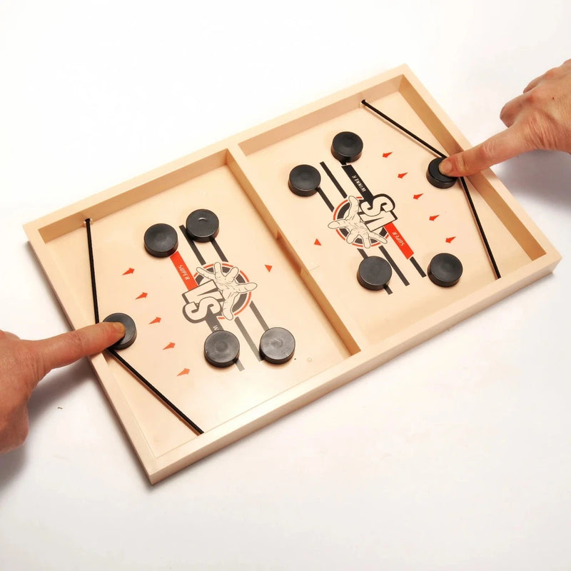Two players setup for an exciting Finger Sling Action Game on a battle board with pucks