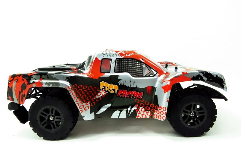 Model off-road truck with red and black design on a white background