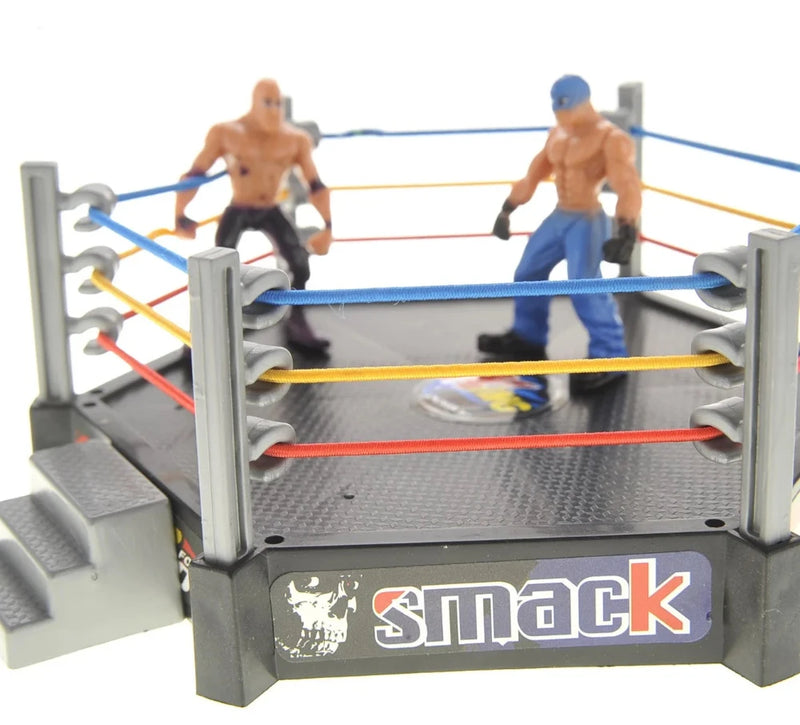 WWE ring playset with wrestlers in action, featuring vibrant ropes and realistic ring design