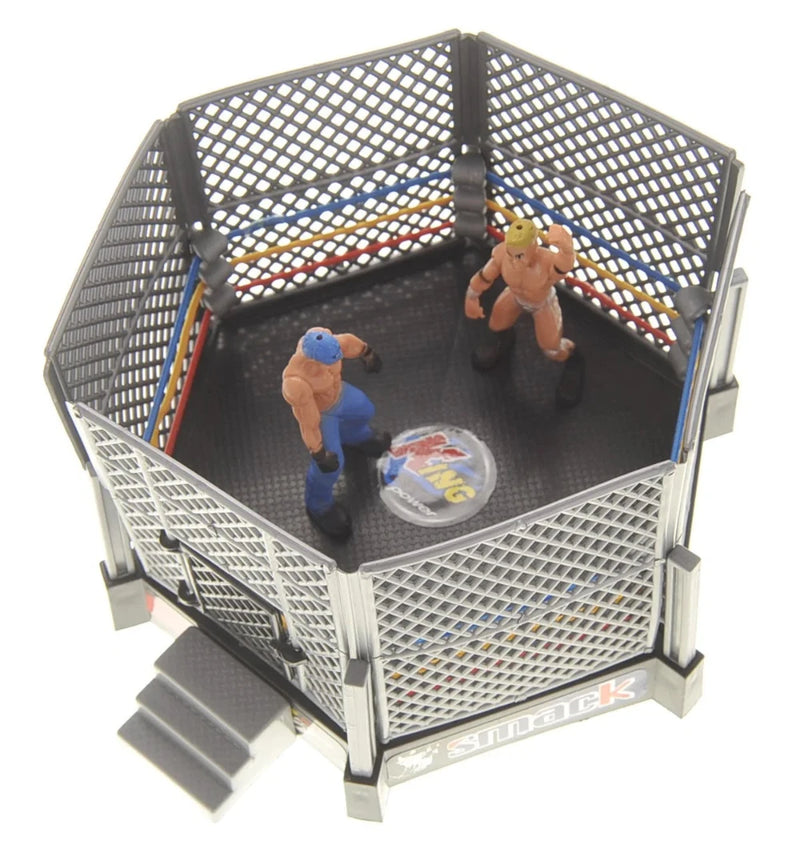 Toy WWE wrestling cage setup with action figures in a realistic cage match scene