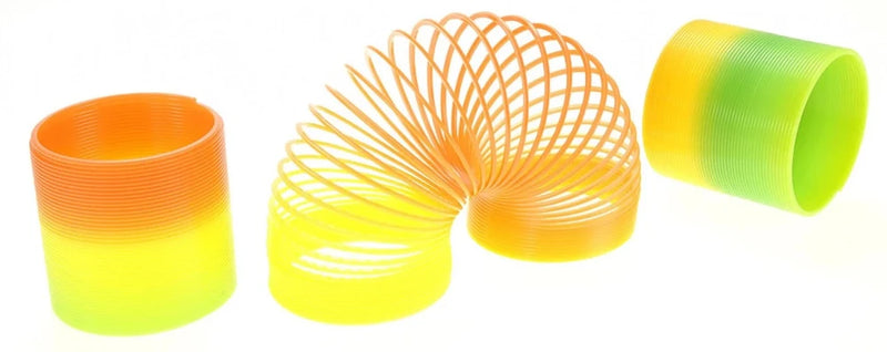 Yellow and green plastic rainbow magic spring, a fun and interactive toy for kids.