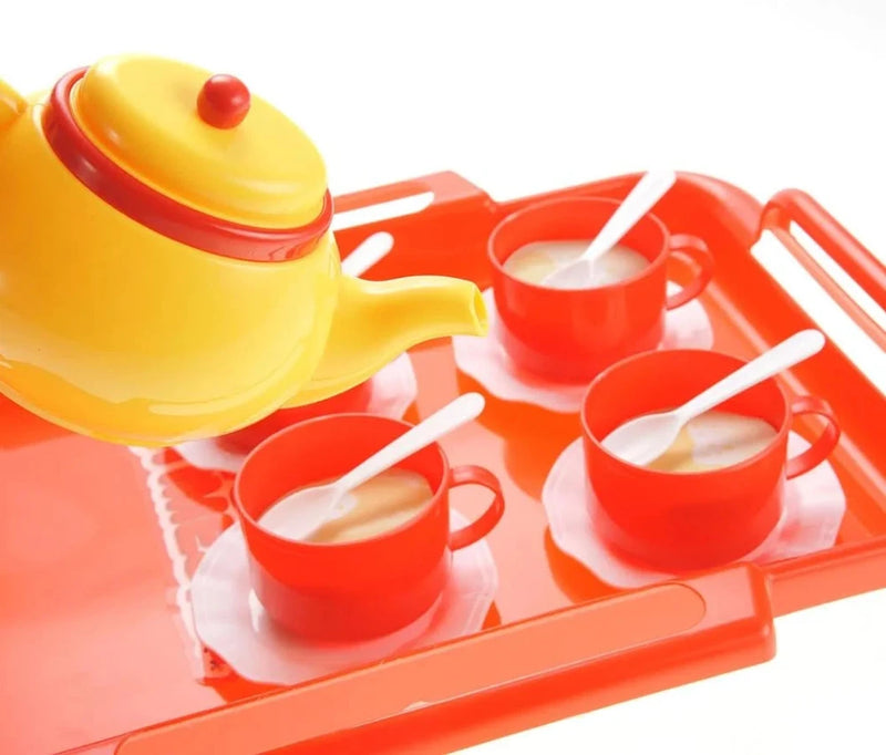Bright yellow toy teapot and red cups with white spoons, perfect for children's pretend tea parties